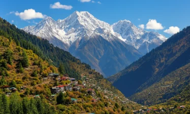 “Snow-covered Himalayan mountain peaks with a scenic valley and colorful hillside village in Himachal Pradesh”
